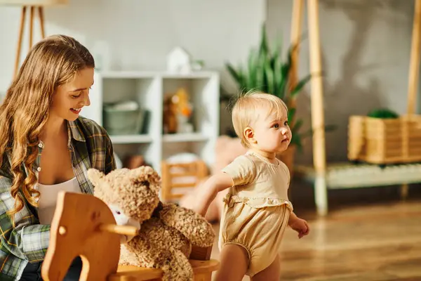 Young Mother Sits Rocking Chair Holding Teddy Bear Next Her — Stock Photo, Image
