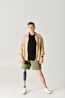 Handsome man with prosthetic leg showcasing his strength and resilience through dance. clipart