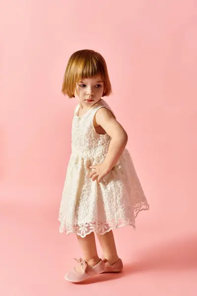 Little Girl White Dress Standing Pink Backdrop — ストック写真