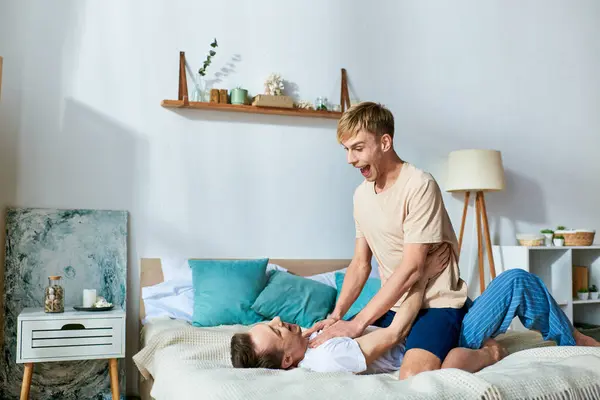 Man Casual Attire Sits Bed Other Man Spending Quality Time — Stock Photo, Image