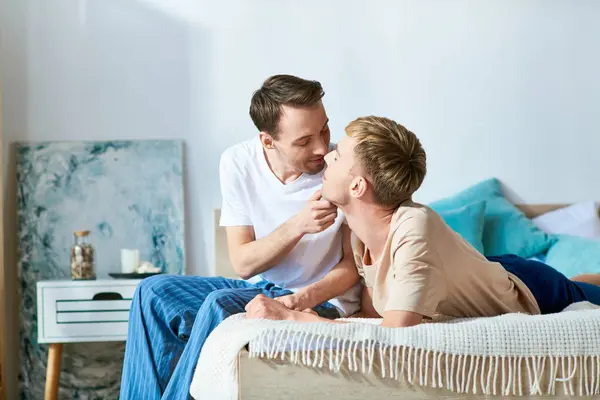 Couple Casual Attire Sitting Lovingly Bed — Stock Photo, Image