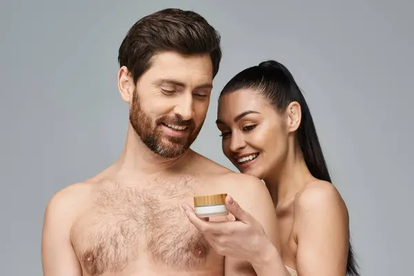 Man Woman Applying Skincare Man Holds Cream Jar — Foto de Stock