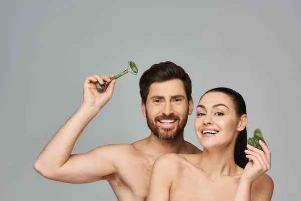 Alluring Couple Radiating Beauty Using Face Roller Gua Sha Together — Stock Photo, Image