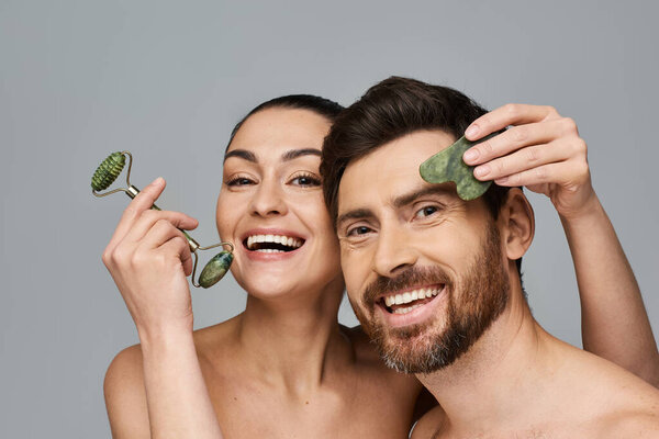 Jolly couple, radiating beauty, using face roller and gua sha together.