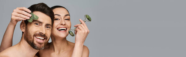 Joyous couple, radiating beauty, using face roller and gua sha together.