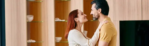 Redhead Woman Bearded Man Share Warm Hug Modern Kitchen Enjoying — Stok fotoğraf