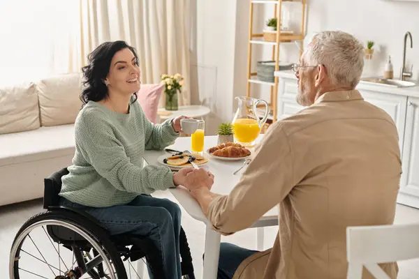 Disabled Woman Wheelchair Being Lovingly Served Orange Juice Her Husband — Stock Photo, Image