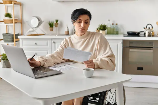 Disabled Woman Wheelchair Works Her Laptop Kitchen Table — Stock Photo, Image