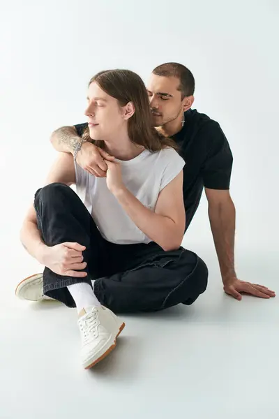 Two Men Sit Closely Together Sharing Moment Connection — Stock Photo, Image