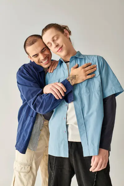 stock image Two men hugging tenderly while standing side by side.
