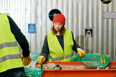 Young volunteers in yellow and green vests work together, sorting trash in an eco-conscious effort.