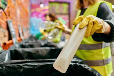A young volunteer dons a yellow vest and gloves, sorting trash alongside a fellow eco-conscious individual.