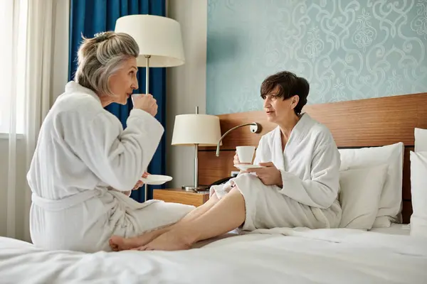 Two Senior Lesbian Women Robes Sitting Close Together Bed Showing — Foto de Stock