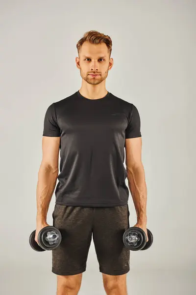Young Sportsman Active Wear Holding Two Dumbbells Front White Background — Stockfoto