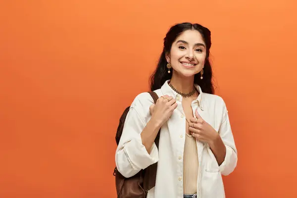 Smiling Young Indian Woman Vibrant Orange Background — ストック写真