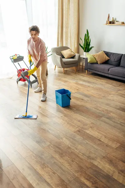 Man Elegantly Mopping Living Room Floor — Stock Photo, Image