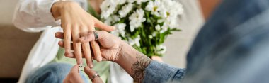 woman gently places a ring on a hand of partner in a heartwarming gesture of love and commitment. clipart