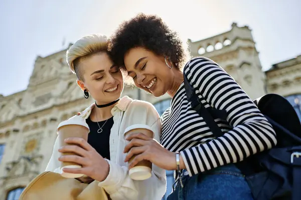 Two Women Casual Attire Smiling Each Other While Holding Coffee — Foto de Stock