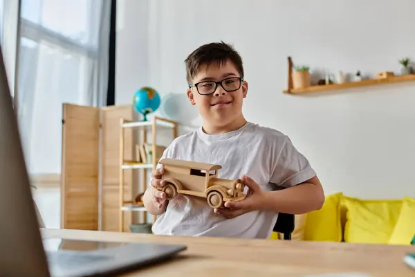 Adorable Boy Syndrome Playing Wooden Toy Car Front Laptop — Foto de Stock