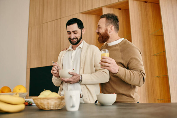 Two men, a happy gay couple, enjoy breakfast together in a modern kitchen, sharing a moment of love and connection.