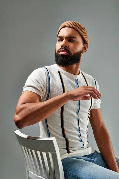 Man Exudes Power Elegance Perches Atop Sleek White Chair Commanding — Foto de Stock