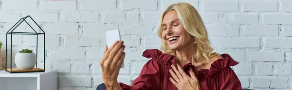 stock image Elegant woman in stylish dress using cell phone.