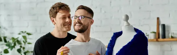 stock image Two men with a mannequin in a designer workshop.