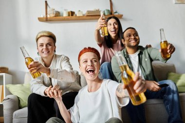 A diverse group of people sitting together on top of a couch, laughing and enjoying each others company. clipart