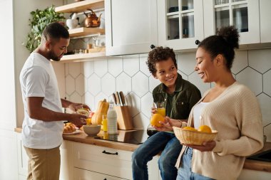 Diverse family joyfully preparing food together in the kitchen. clipart