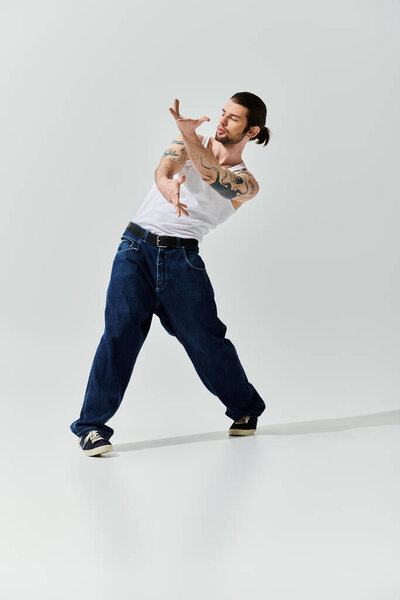 Caucasian man in white t-shirt performs captivating trick.