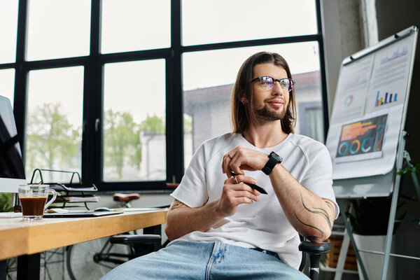 A caucasian businessman immersed in work on his computer while seated in a chair.