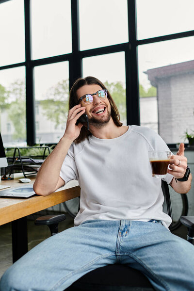A caucasian businessman sitting at a desk, actively engaged in a phone call.