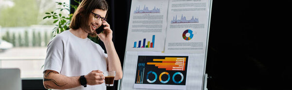 A handsome Caucasian businessman converses on a cell phone.