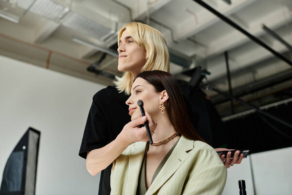 A professional stylist applying makeup on womans face.