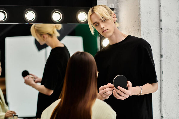 Professional stylist applying makeup on womans face.
