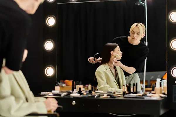 stock image Beautiful woman enjoying makeup session with stylist.