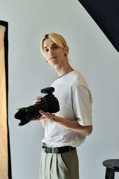 Male photographer taking snapshots in studio.