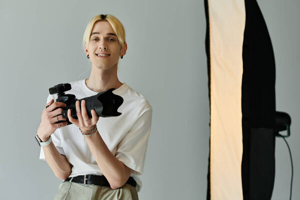 Man holds camera before a light.