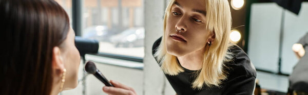 Attractive makeup artist transforms a womans look.