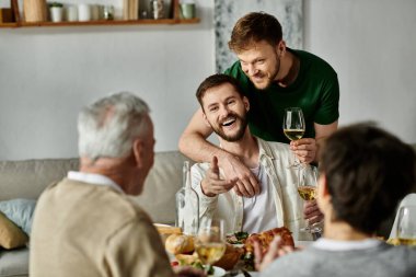 A gay couple enjoys a meal with their family, filled with laughter and warmth. clipart