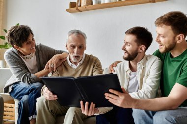 A gay couple shares a photo album with parents in their living room. clipart