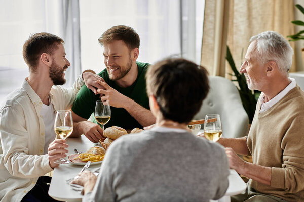A gay couple enjoys a meal with parents at home.
