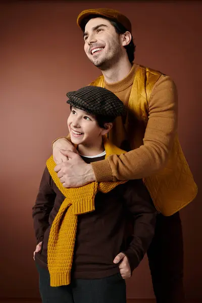 stock image A father and son share a warm embrace, their smiles radiating happiness.