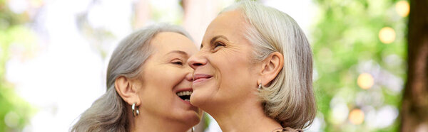 A lesbian couple enjoys a camping trip in a verdant forest.