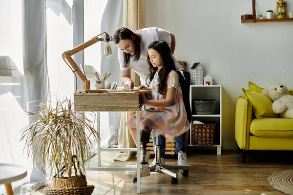 A brunette mother and her daughter, who has a prosthetic leg, are spending quality time at home.