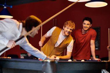 Friends play billiards in a casual setting. clipart