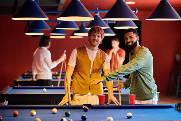 Friends play billiards together in a casual setting, showcasing a playful and enjoyable evening out.