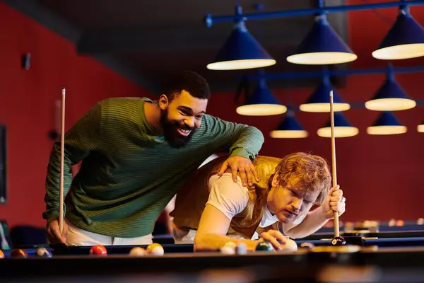 stock image Friends enjoy a casual game of billiards in a stylish setting.
