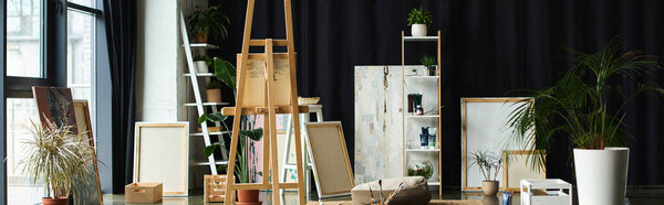 A spacious studio with an easel and canvases