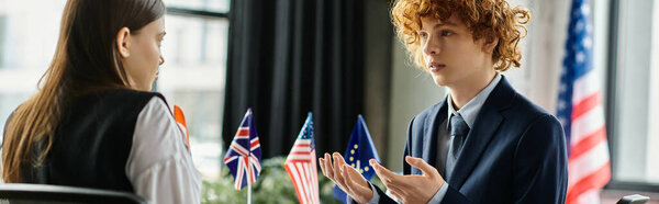 Two teenagers participate in a UN Model conference.